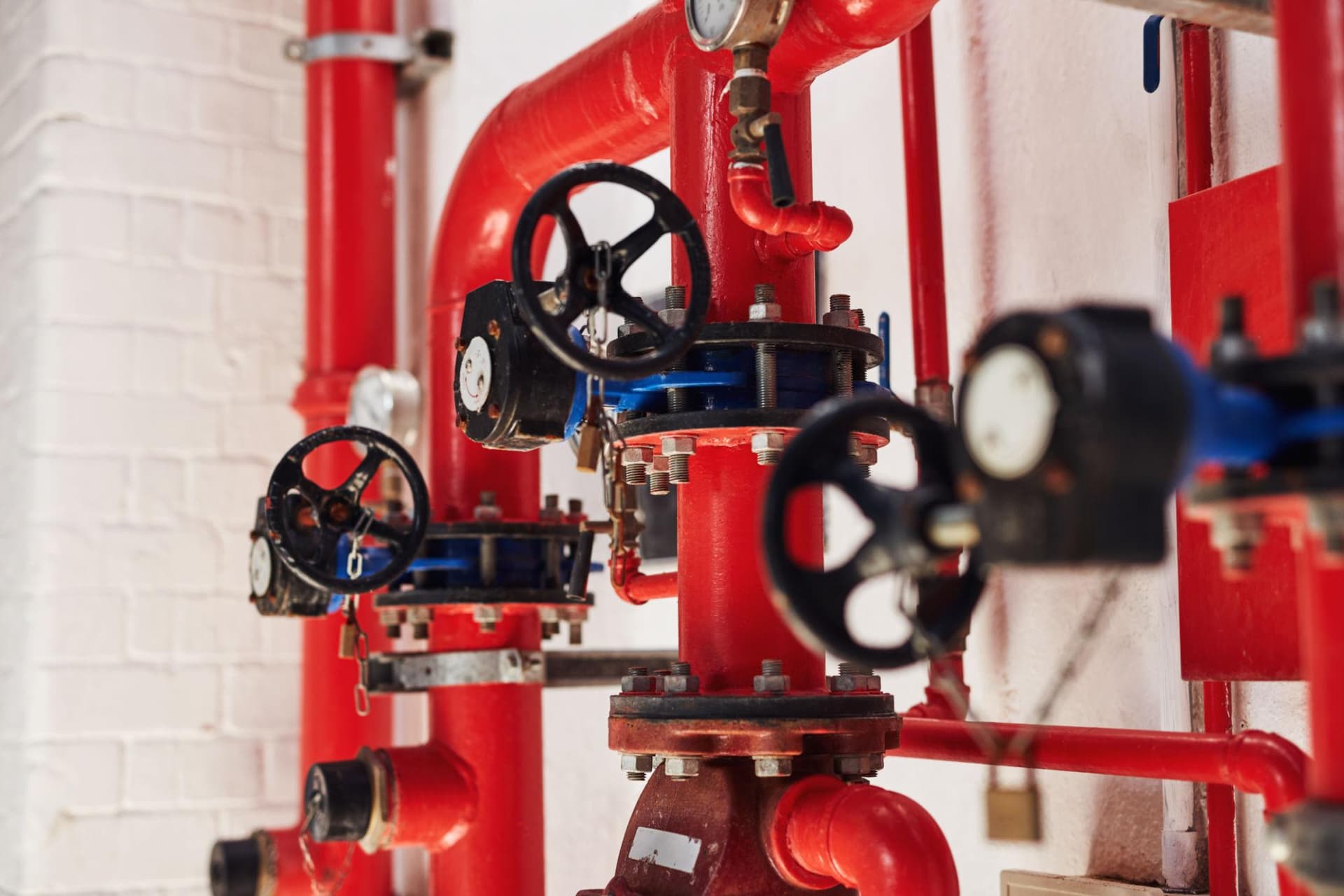 Fire suppression system piping and valves in a commercial kitchen