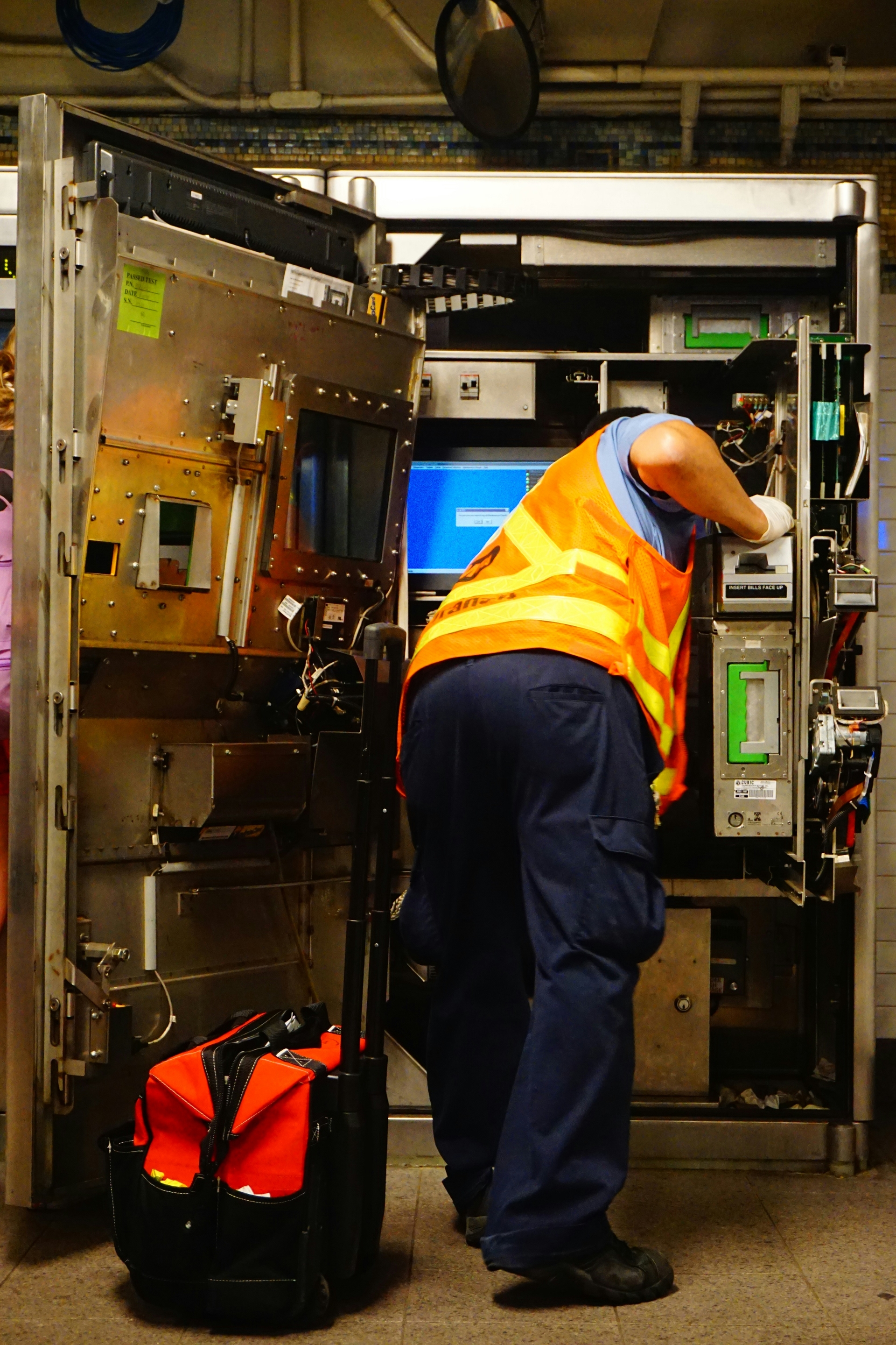Commercial kitchen equipment installation with stainless steel appliances