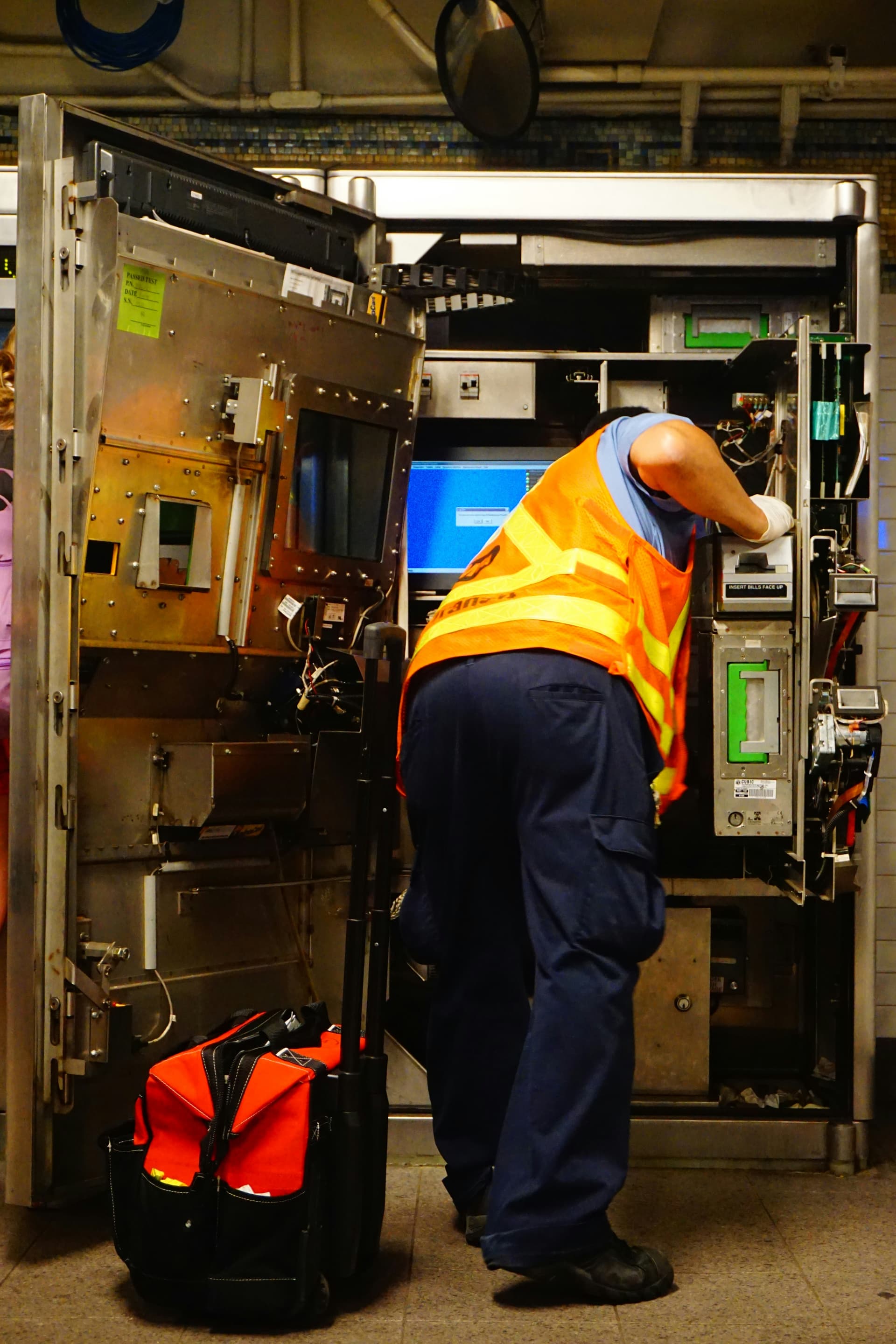 Commercial kitchen equipment installation with stainless steel appliances