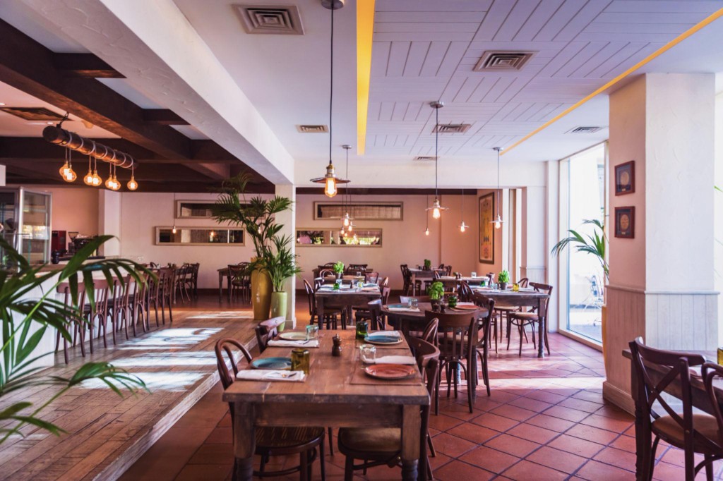 Warmly lit dining room at Bella Italia Ristorante