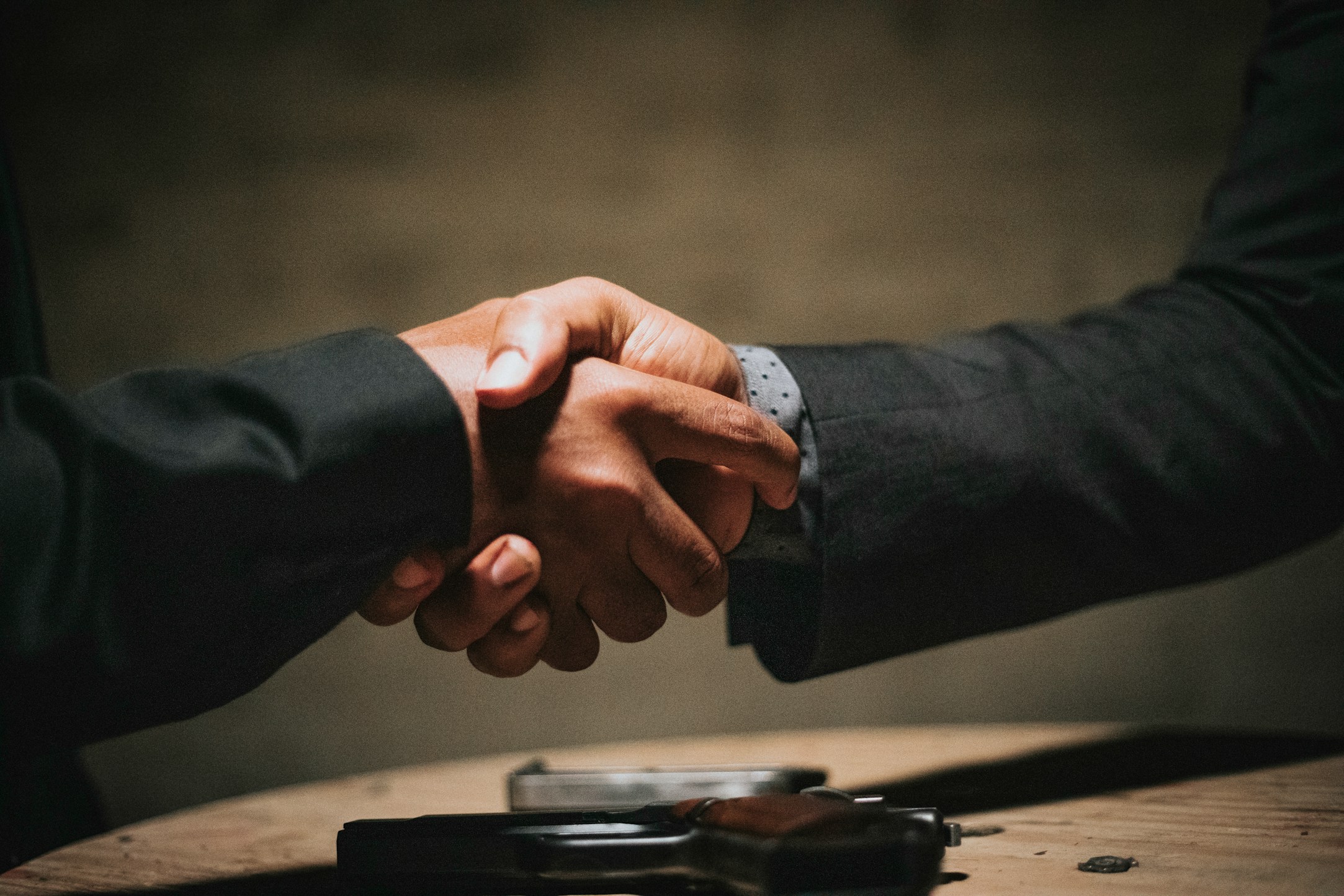 Business partners shaking hands over a commercial agreement